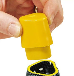 A person's hand holding a yellow spare battery, presumably the EC-10 model, with a partial view of a device into which the battery is being inserted.